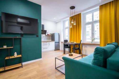 TV a/nebo společenská místnost v ubytování Apartament Łokietka