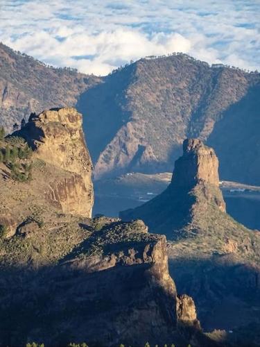a view of a mountain range with a body of water at La Casita de Coco Tejeda in Tejeda