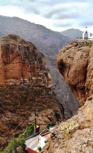 a view of a mountain with a cross on top at La Casita de Coco Tejeda in Tejeda