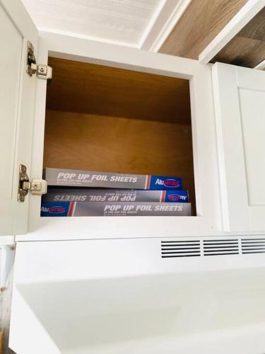 a stack of books sitting inside of a drawer at Overlook Too! at Lake Koshkonong in Milton