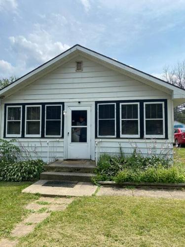 a white house with a white door and windows at Overlook Too! at Lake Koshkonong in Milton