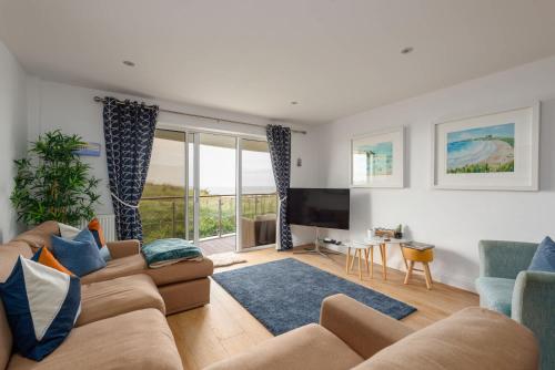 a living room with a couch and a tv at Host & Stay - Sunset in Newquay
