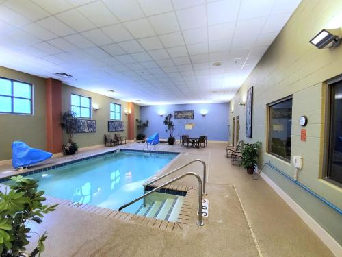 a swimming pool with a slide in a building at Jefferson Street Inn in Wausau