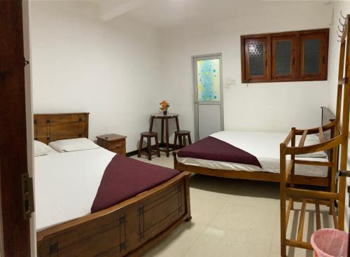 Postel nebo postele na pokoji v ubytování Geeth Lanka River Resort