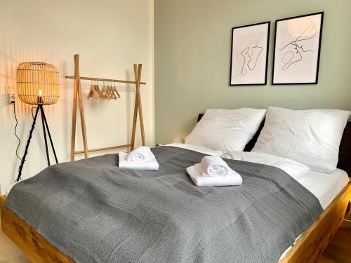 a bedroom with a bed with two towels on it at Cozy one bedroom apartment in Augsburg in Augsburg