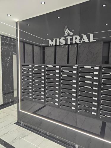 a dressing room with a misfahan sign on the wall at Apartmani Novi Sad Center in Novi Sad