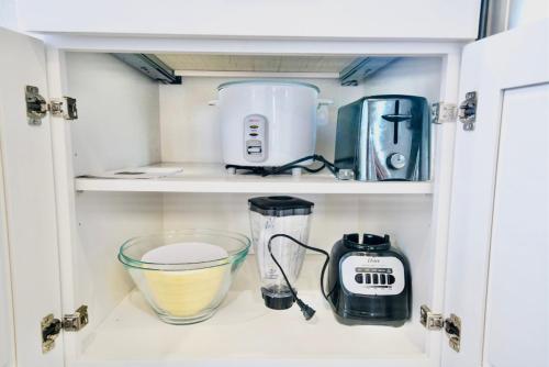 a kitchen pantry with a blender and other kitchen appliances at 10 Bedroom Historical Downtown Albany Pet Friendly Home in Albany