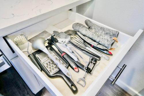 a drawer filled with cooking utensils in a kitchen at 10 Bedroom Historical Downtown Albany Pet Friendly Home in Albany