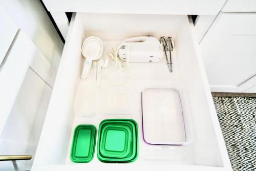 a drawer in a kitchen with green and white at 10 Bedroom Historical Downtown Albany Pet Friendly Home in Albany