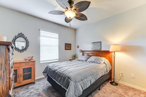 a bedroom with a bed and a ceiling fan at Fire Table and Home Gym Secluded Naples Home in Naples