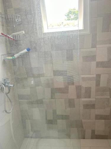 a bathroom with a shower with a glass door at Pool Side Punta Cana in Punta Cana
