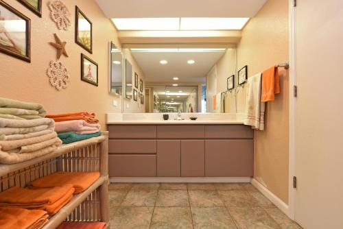 a bathroom with a sink and a mirror at Maui Eldorado Condo J100 in Kaanapali