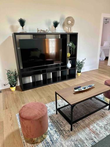 a living room with a large flat screen tv at Beautiful Contemporary 2BDR in Concord