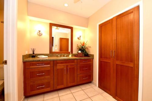 a bathroom with a sink and a mirror at Maui Eldorado Condo J221 in Kaanapali
