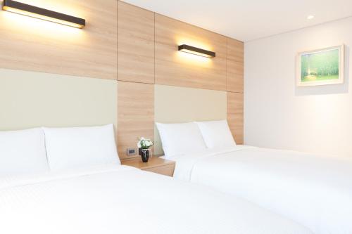 Postel nebo postele na pokoji v ubytování Acube Hotel Dongdaemun