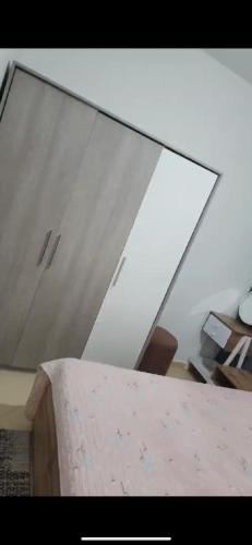 a mirror in a room with a table at Basatin targa a giliz in Douar Moulay Hafid