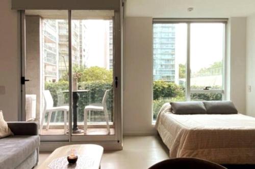 En eller flere senge i et værelse på Monoambiente Edificio DOMUS Full GYM Piscina Infinita Laundry Seguridad24hs