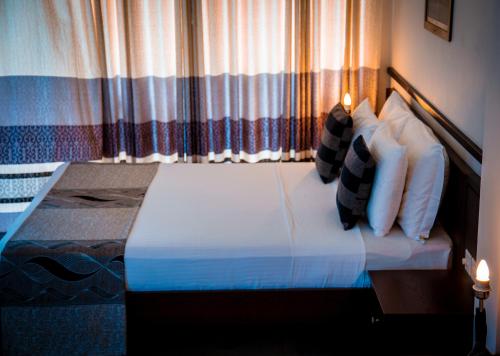 Cama o camas de una habitación en Riverside Inn Fuji
