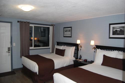 Postel nebo postele na pokoji v ubytování Rest Inn
