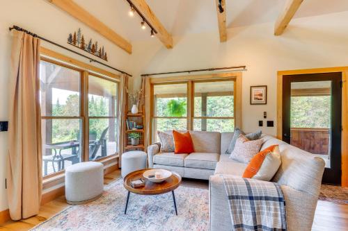 a living room with a couch and a table at Fire Pit and Views Pet-Friendly Vermont Cabin in Craftsbury