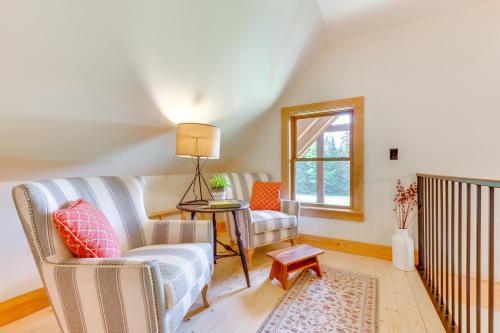 a living room with two chairs and a table at Fire Pit and Views Pet-Friendly Vermont Cabin in Craftsbury
