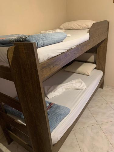 a couple of bunk beds in a room at Pousada Ohana Rj in Rio de Janeiro
