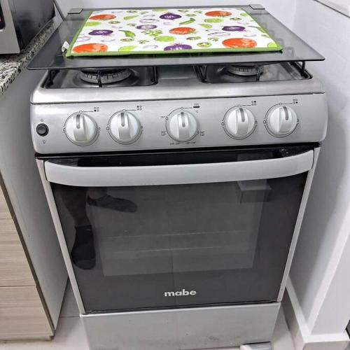 a kitchen oven with a pizza on top of it at Pool Sensation Punta Cana in Bávaro