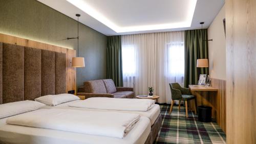 Postel nebo postele na pokoji v ubytování Hotel Restaurant Erber