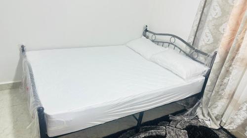 Giường trong phòng chung tại SK Lodge Kinshasa