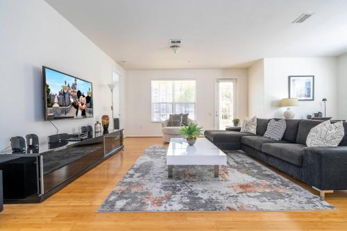 a living room with a couch and a tv at Wonderful Apt Convention Center VistaCay VC50253 in Orlando