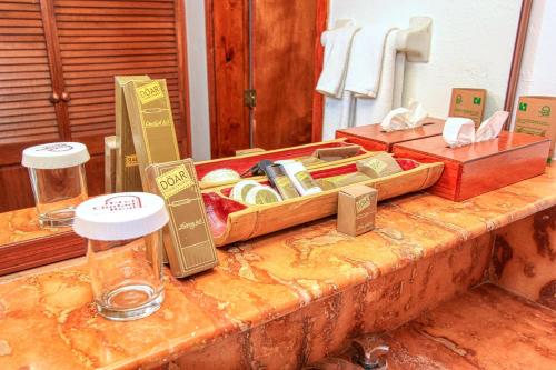 a table with a tray of food on top at Hotel Ciudad Real Palenque in Palenque