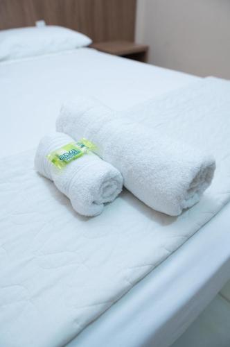 Llit o llits en una habitació de Hotel Alibertti