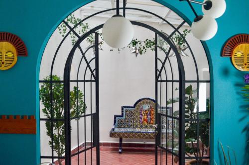 a room with an iron gate with a chair in it at Nokal Exclusive Stay in Mexico City