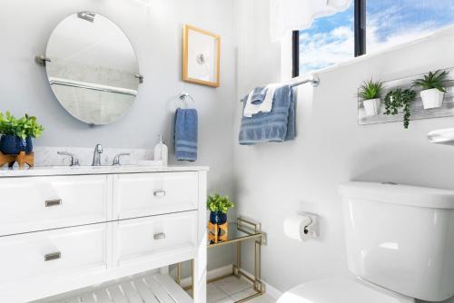 a bathroom with a sink and a mirror at Beach Rd, 300ft to Beach Access & 500ft to Siesta Key Village, 2bdr & Studio in Siesta Key