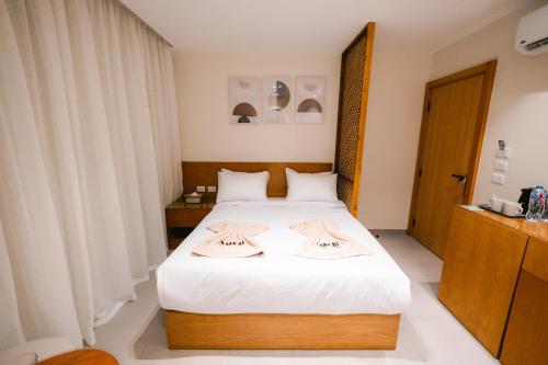 Postel nebo postele na pokoji v ubytování Makai Pyramids Guest House