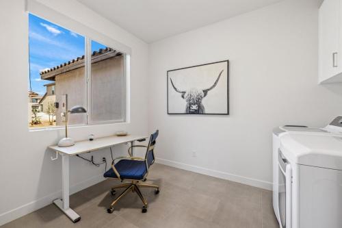 a home office with a desk and a bull on the wall at PGA West 65 - 3 bdrm w/Loft, Sleeps 8, Pool, Gym in La Quinta