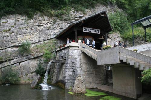 a restaurant on a bridge next to a waterfall at Tranquil Retreat in Hamoir, Belgium - Perfect for Families Friends in Hamoir