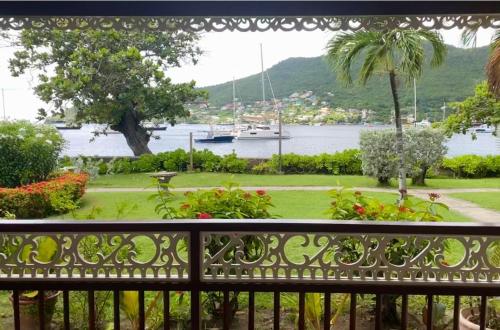 a balcony with a view of a body of water at Gingerbread Suites in Port Elizabeth
