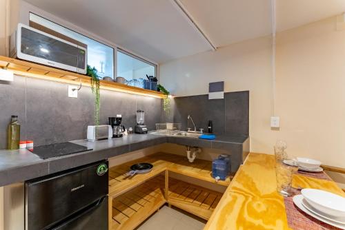 a kitchen with a sink and a counter at Casa Jicama in Cancún