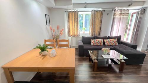 a living room with a couch and a table at Contractors 2 Bed Apartment in Stevenage By White Orchid Property Relocation in Stevenage