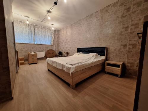 a bedroom with a bed and a tv in it at Baku apart 20 yanvar in Baku