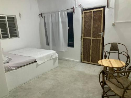 Ένα ή περισσότερα κρεβάτια σε δωμάτιο στο Barefeet Bungalow