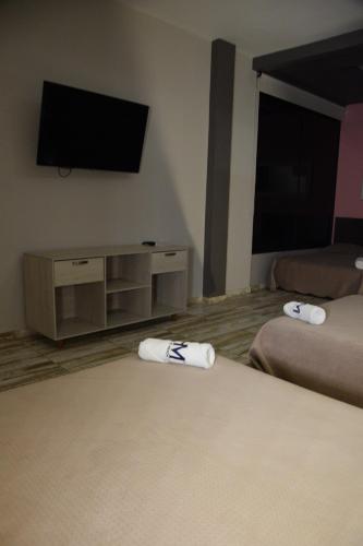Katil atau katil-katil dalam bilik di Hotel El Meson