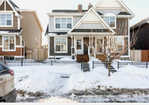 a house with snow in front of it at Basement Apartment in Calgary