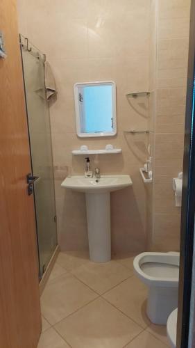 a bathroom with a sink and a toilet at Beralmar in Asilah