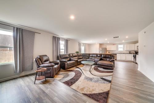 a living room with leather couches and a table at Spacious Home 8 Mi to Bernheim Arboretum! in Shepherdsville