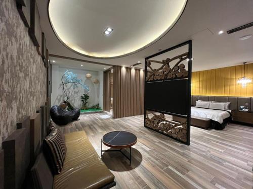 a bedroom with a bed and a fireplace in a room at Aquarius Motel in Taichung