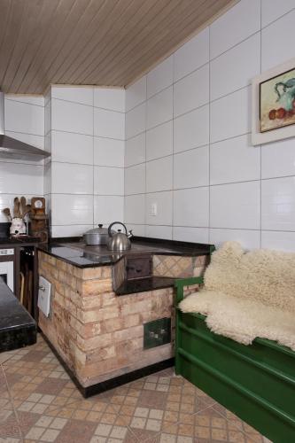 a kitchen with a counter and a stove in a room at Sítio Quinta do sossego in Indaial