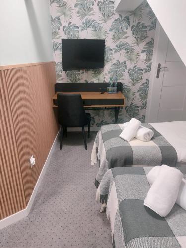 Una cama o camas en una habitación de Browar Gościniec Chojnice