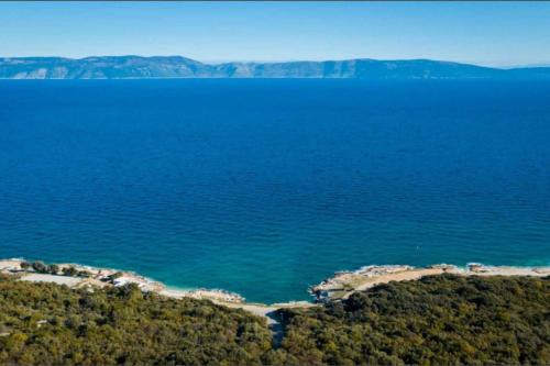 an aerial view of a large body of water at Apartment in Ravni 46700 in Ravni